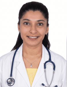 dr .merin mery - Pathway Hospital Female doctor in a white coat with a stethoscope smiling at the camera, head-and-shoulders portrait.